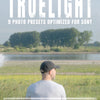 Cover image of the Truelight Photo Presets — a photographer sitting by a calm riverside under soft daylight, facing away from the camera. Large title text reads “TRUELIGHT – 9 Photo Presets Optimized for Sony”, emphasizing documentary roots, honest tones, and natural color. The image conveys quiet cinematic realism and subtle color grading for Sony RAW photography.